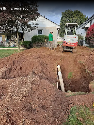 New sewer line installation with mini excavator and PVC