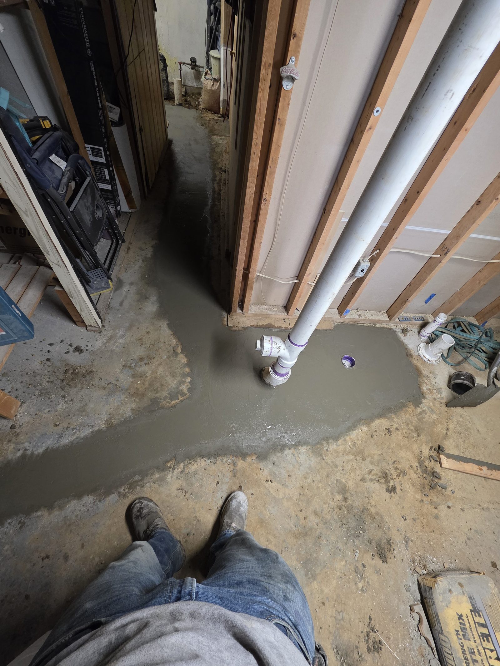 Floor drain PVC installation with fresh concrete