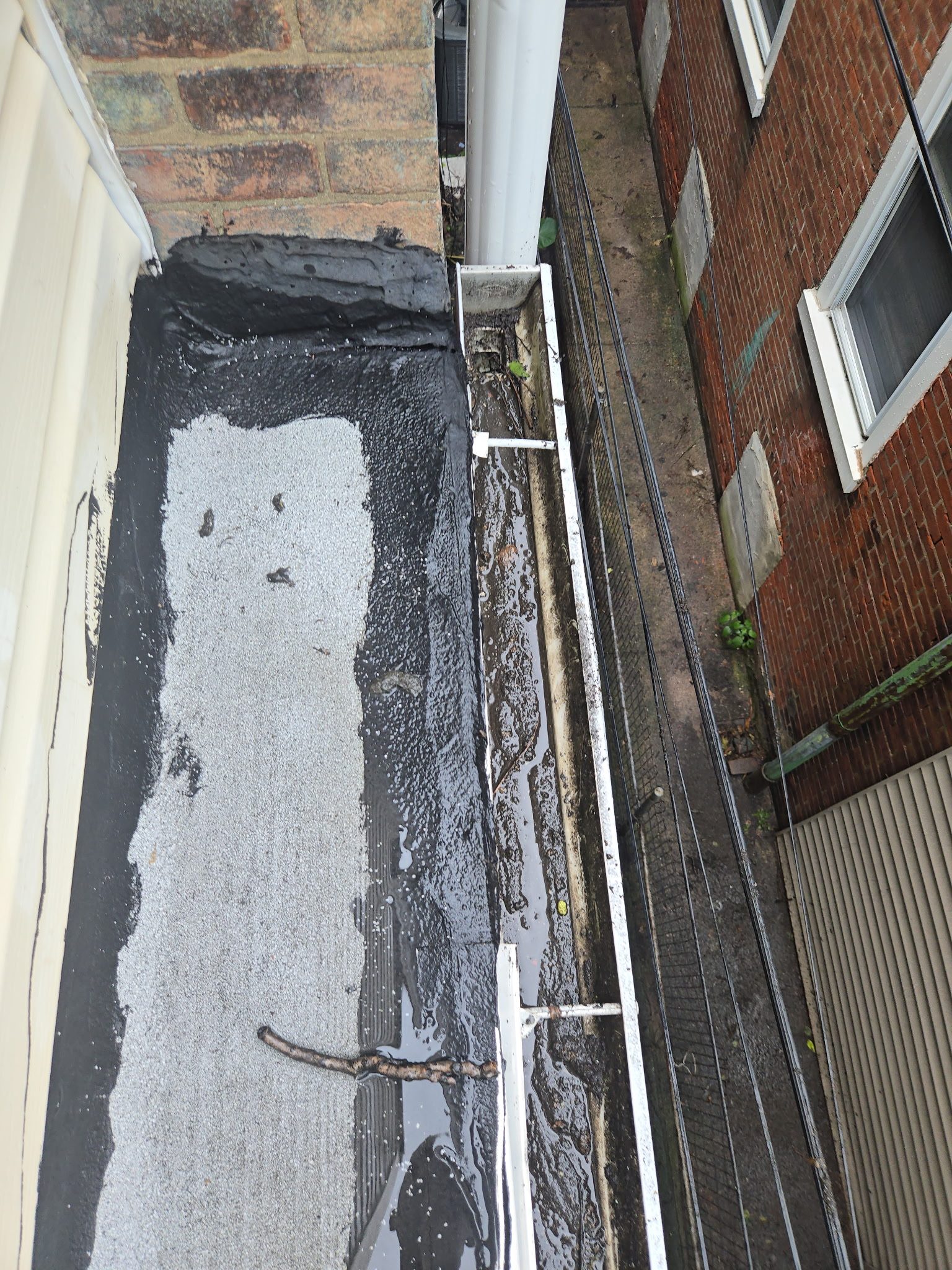 Roof and gutter maintenance work in progress